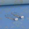 Sterling Silver Dangle Earrings with Pearls and American Diamond Accents - Image 3
