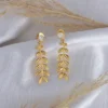 Leafy Tassel Earrings with Elegant Gold Detailing - Image 3