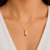Minimalist Gold Cuboid Bar Pendant with Green Gemstone - Image 2
